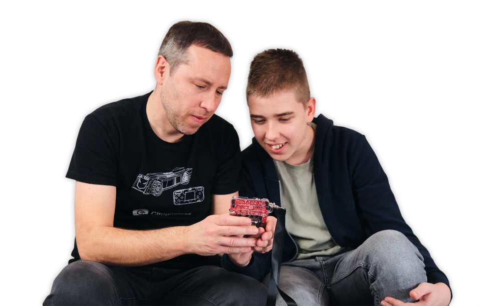 Father and son playing with CircuitMess Bit