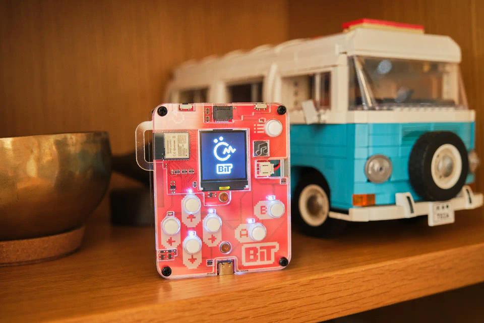 CircuitMess Bit on a shelf among other toys