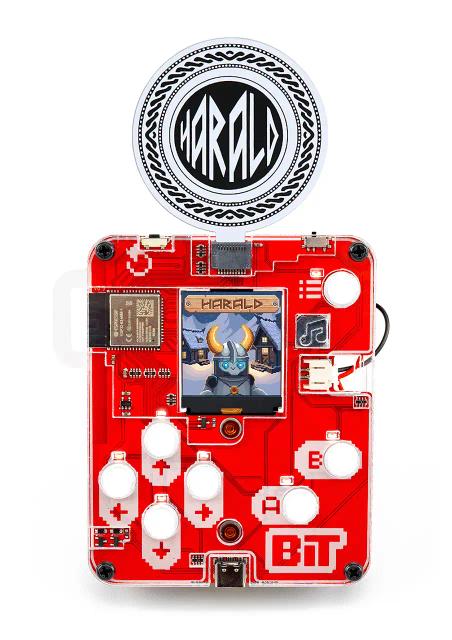 CircuitMess Bit with a Harald game token attached to it