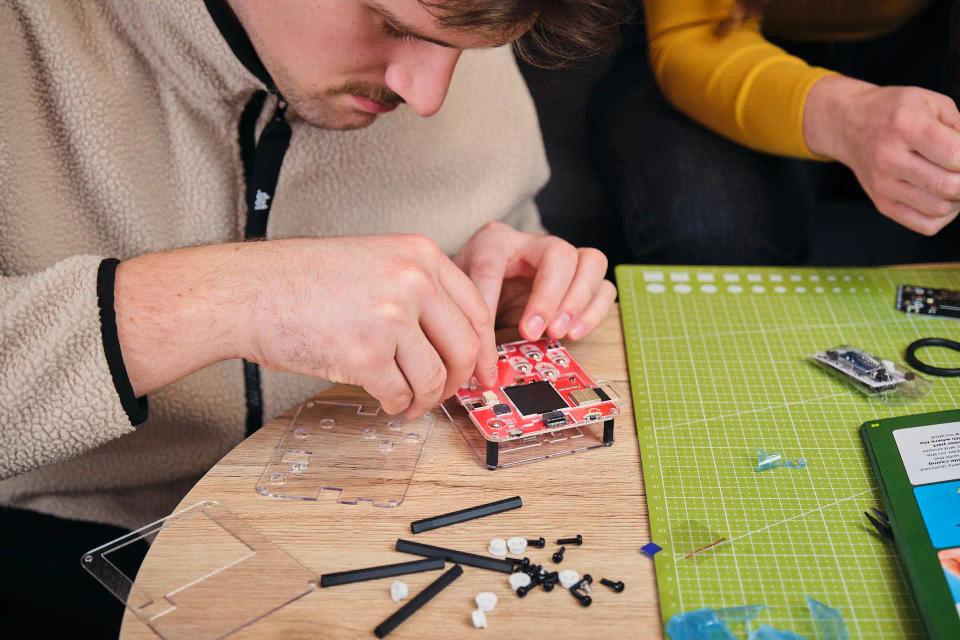 A man assembling CircuitMess Bit