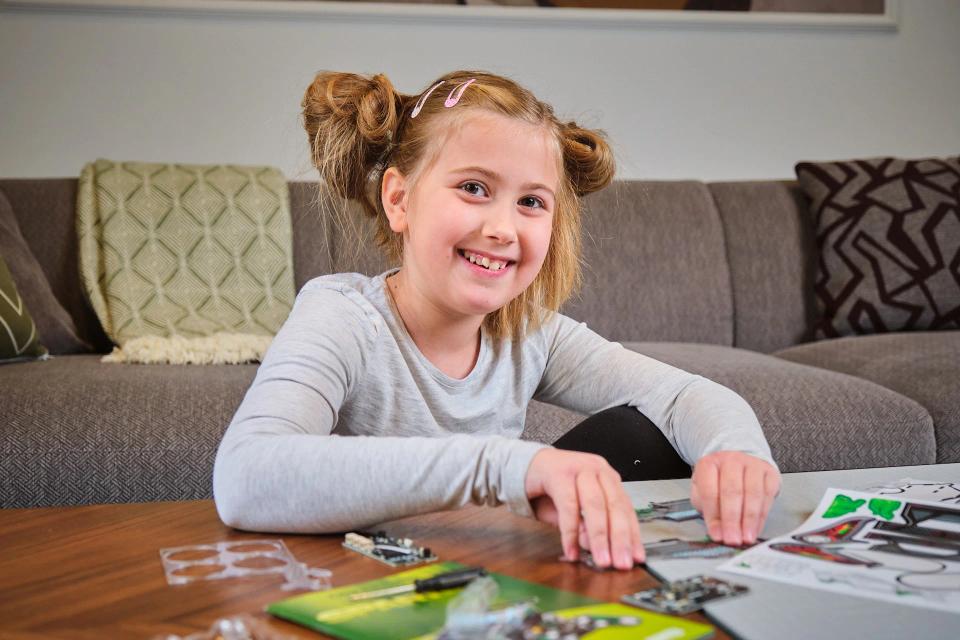 A girl assembling CircuitMess Sparkly