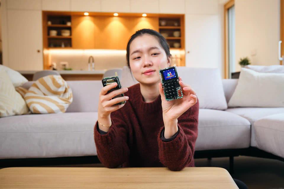 A woman playing with CircuitMess Chatter