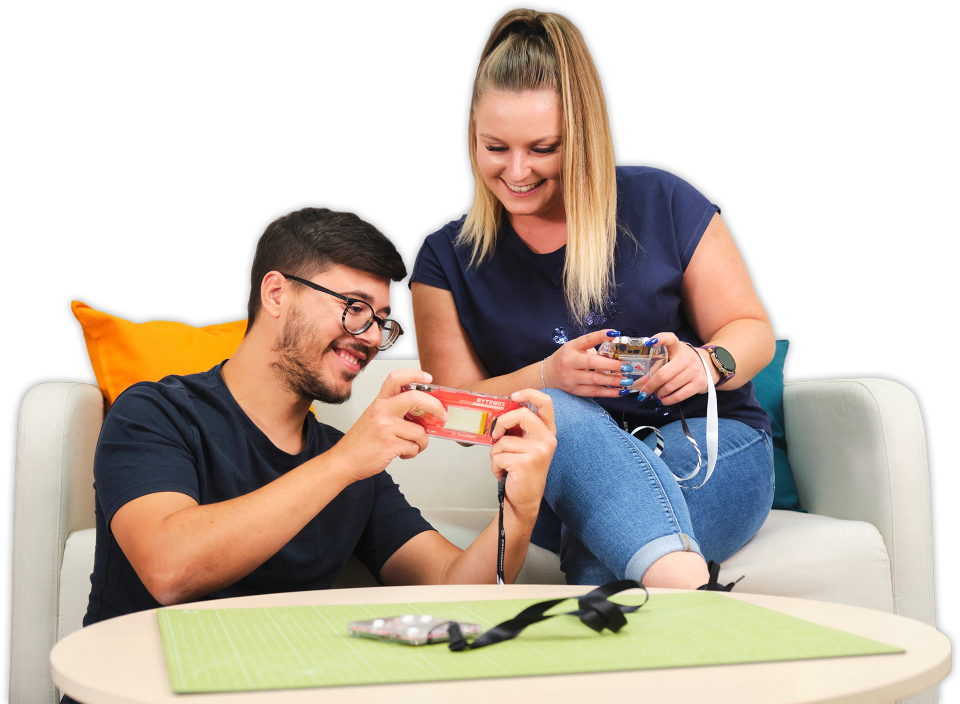 Two people playing with CircuitMess Bit 2.0, Codee 2.0 and ByteBoi