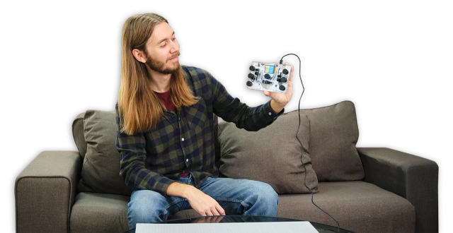 A man showing CircuitMess Jay-D 2.0.