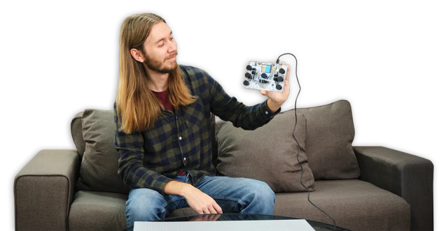 A man showing CircuitMess Jay-D 2.0.