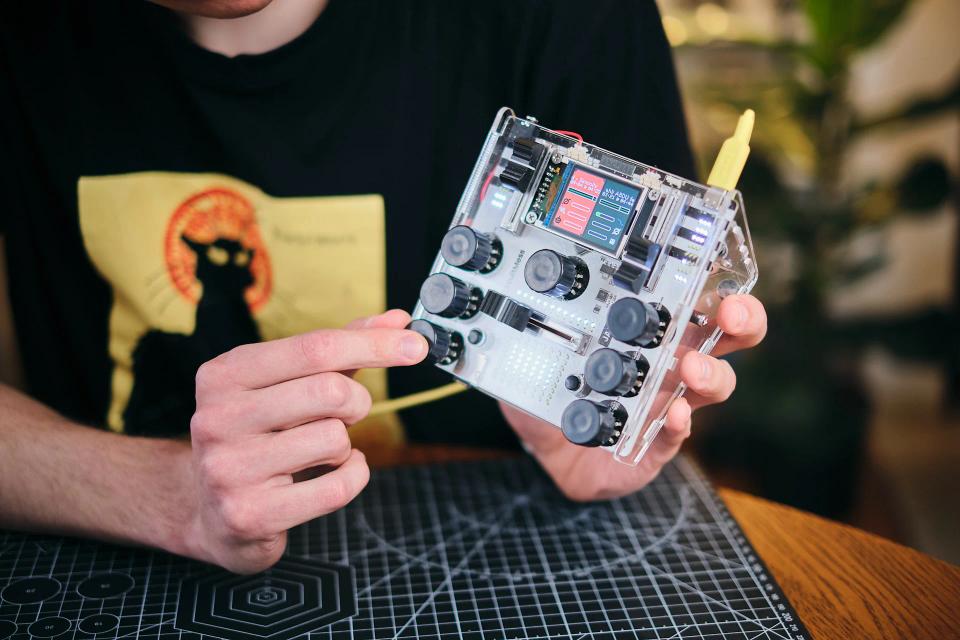 A man playing with CircuitMess Jay-D