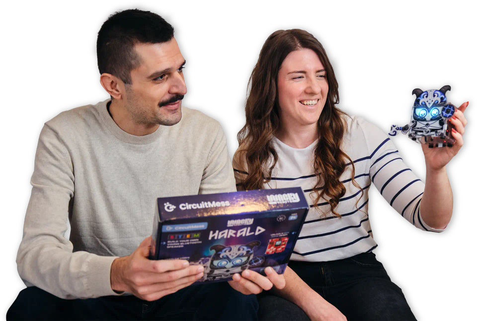 Two people playing with CircuitMess Harald