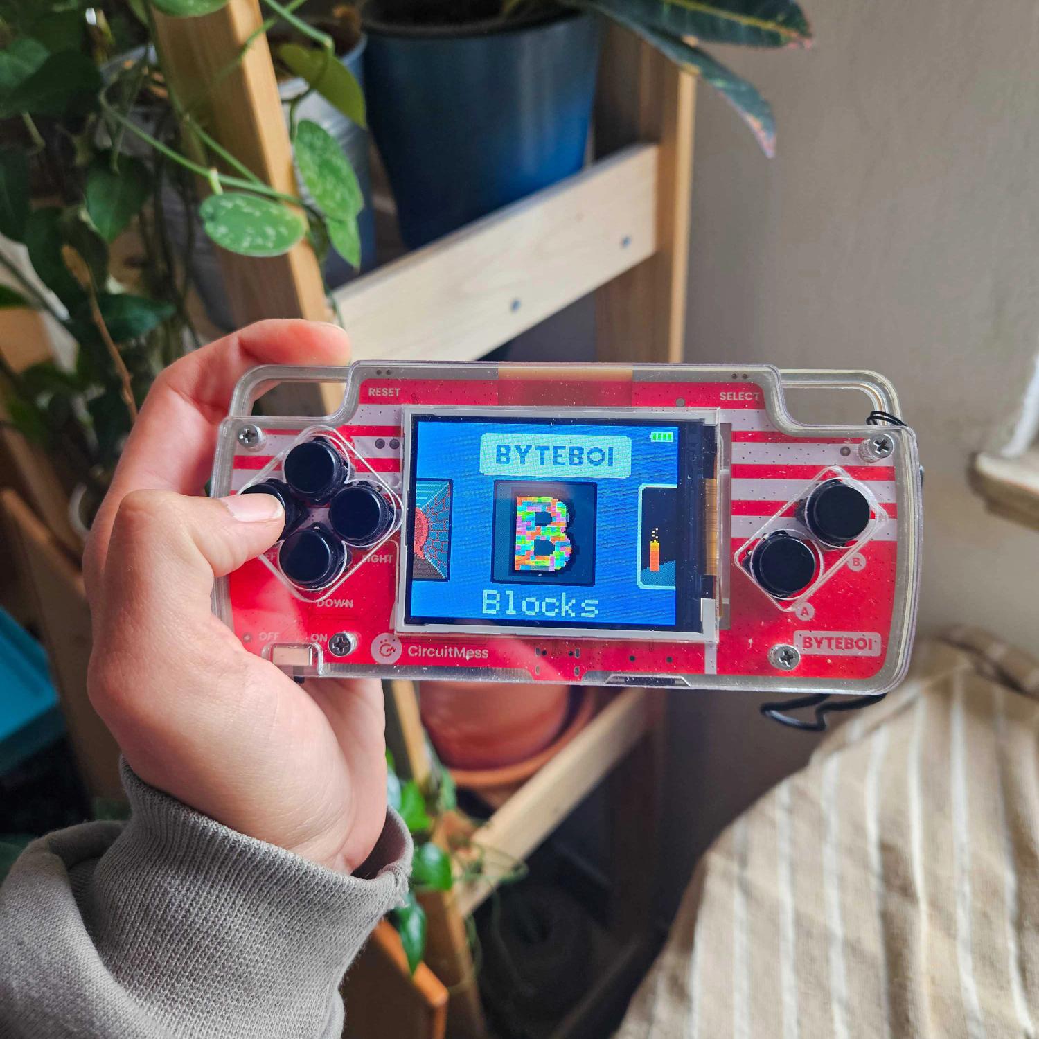 Person holding CircuitMess ByteBoi