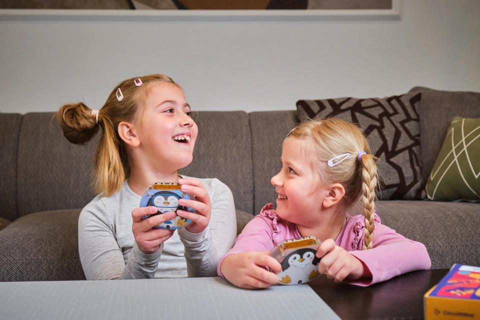 Two girls playing with CircuitMess Codees