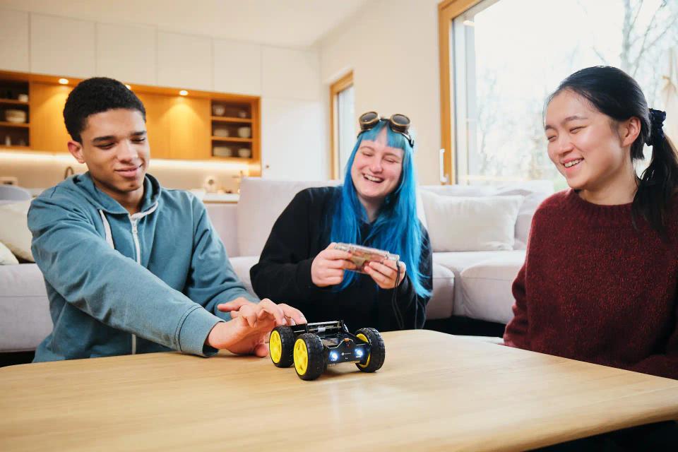 A group of people controlling CircuitMess Wheelson with ByteBoi