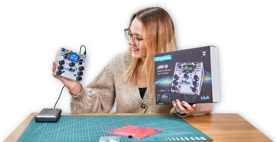 A woman holding CircuitMess Jay-D