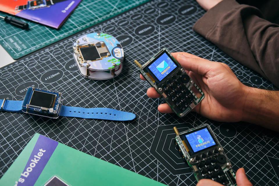 A person looking at CircuitMess Chatter, Clockstar, and Codee