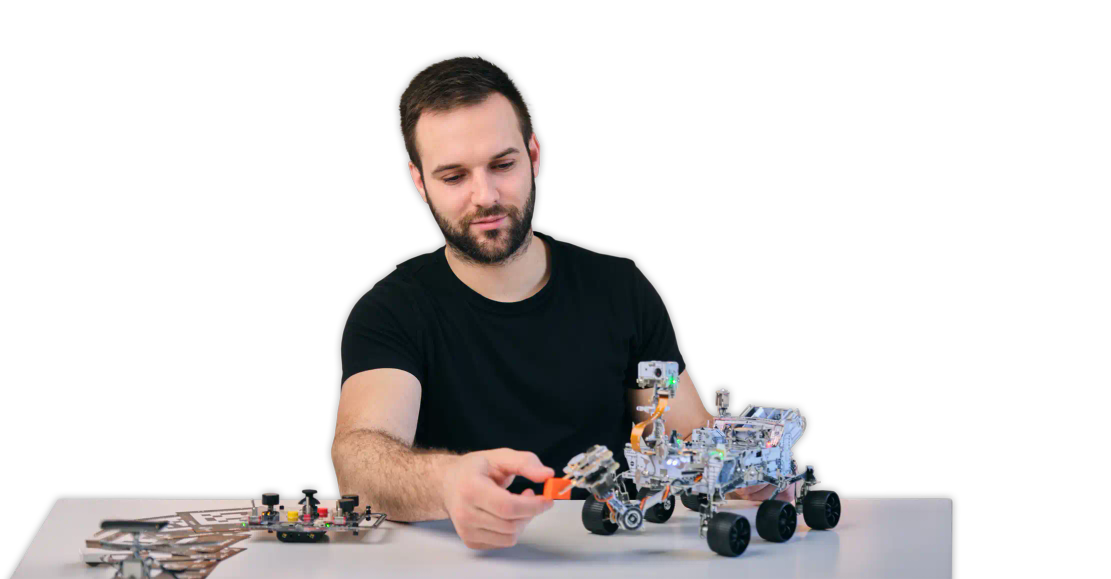 Man assembling CircuitMess NASA Mars Rover