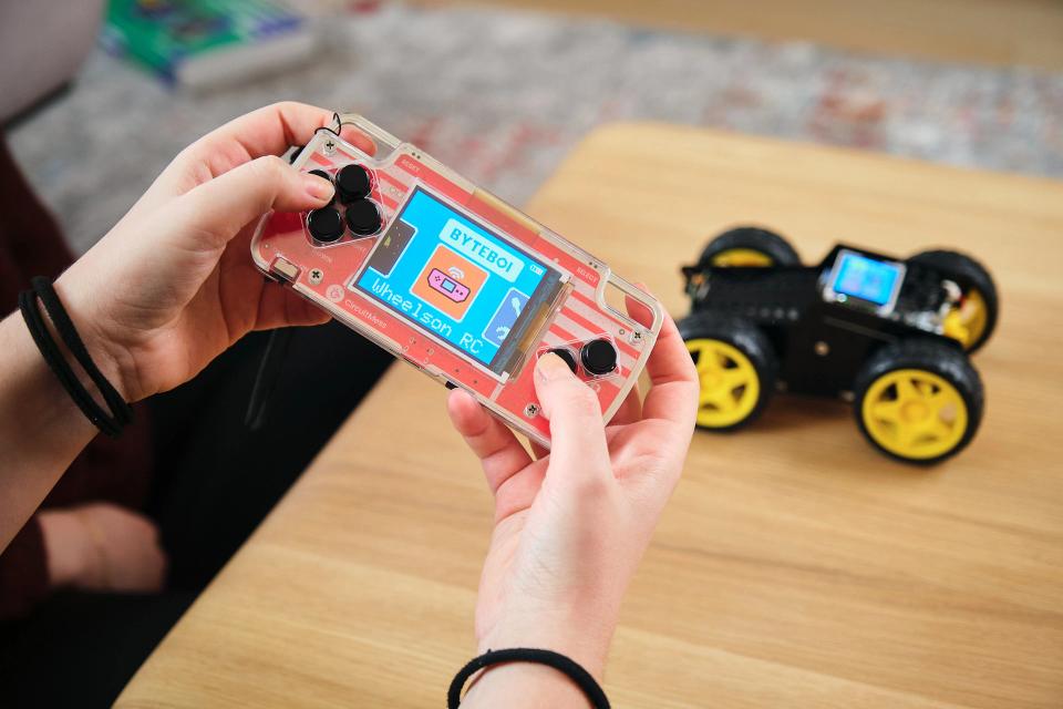 A person controlling CircuitMess Wheelson with ByteBoi