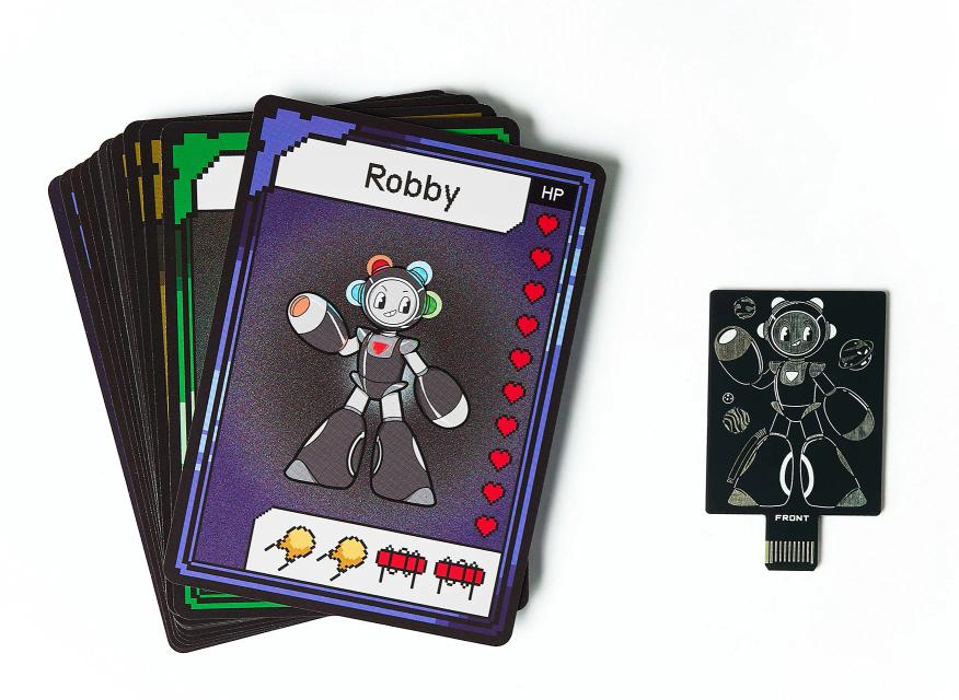 CircuitMess Bit Expansion Robby cards and token on a white background.