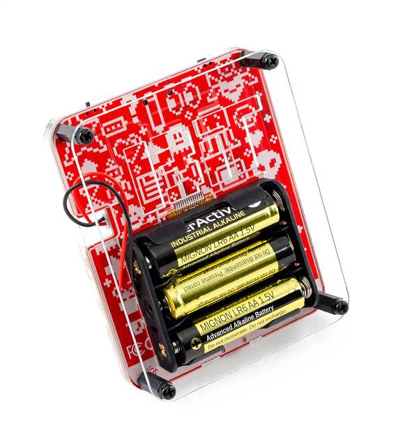 The back of CircuitMess Bit, with three AA batteries included