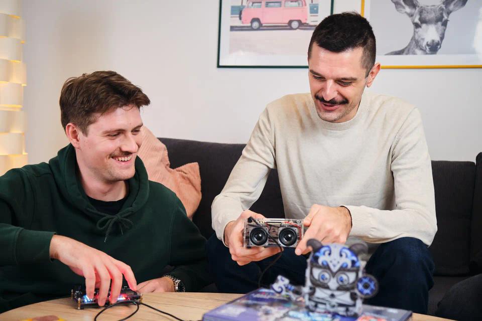 Two men playing with CircuitMess Synthia, Jay-D, and Harald