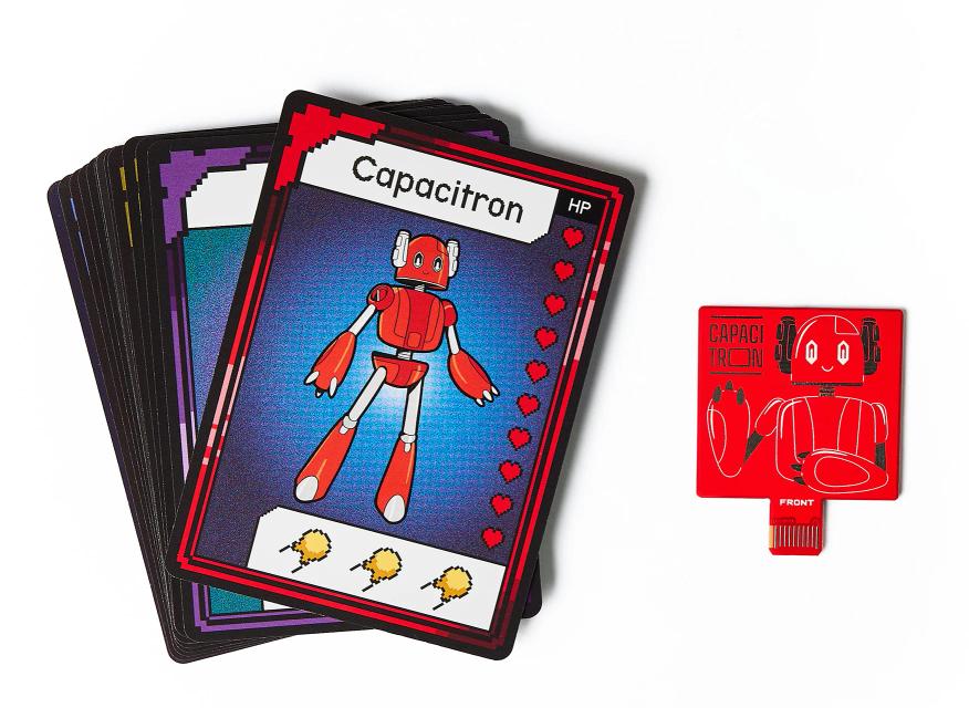 CircuitMess Bit Expansion Capacitron card and token on a white background.