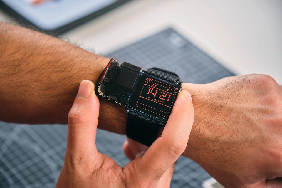 A person playing with CircuitMess NASA Artemis Watch