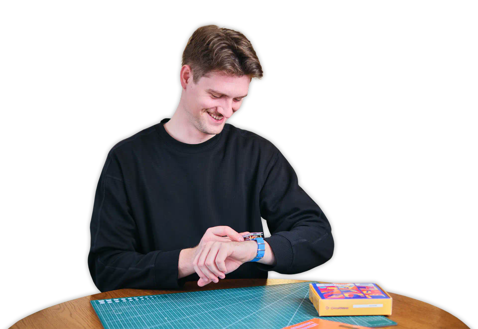Man playing with CircuitMess Clockstar