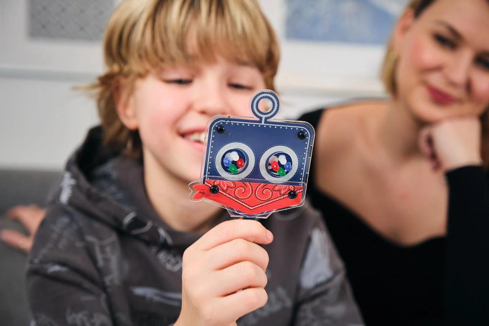 Mother and son playing with CircuitMess Marv