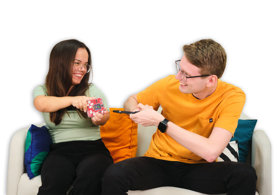 A man and a woman playing with CircuitMess Bit 2.0