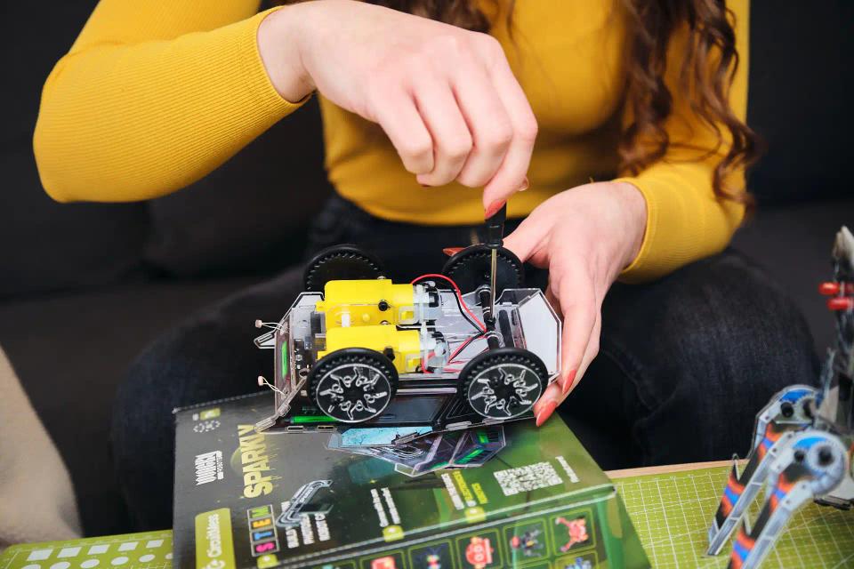 A woman assembling CircuitMess Sparkly