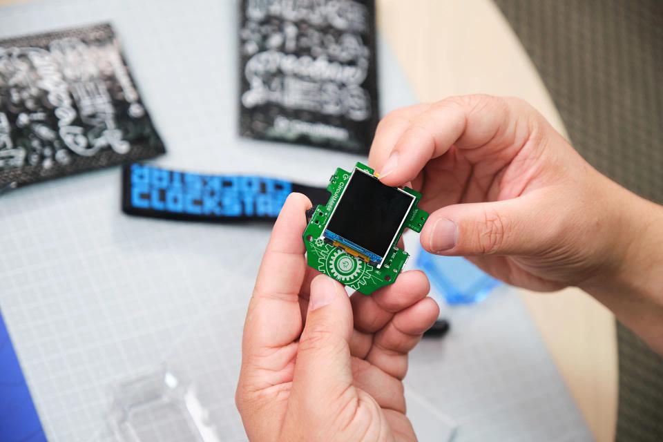 A person assembling a CircuitMess Clockstar 2.0