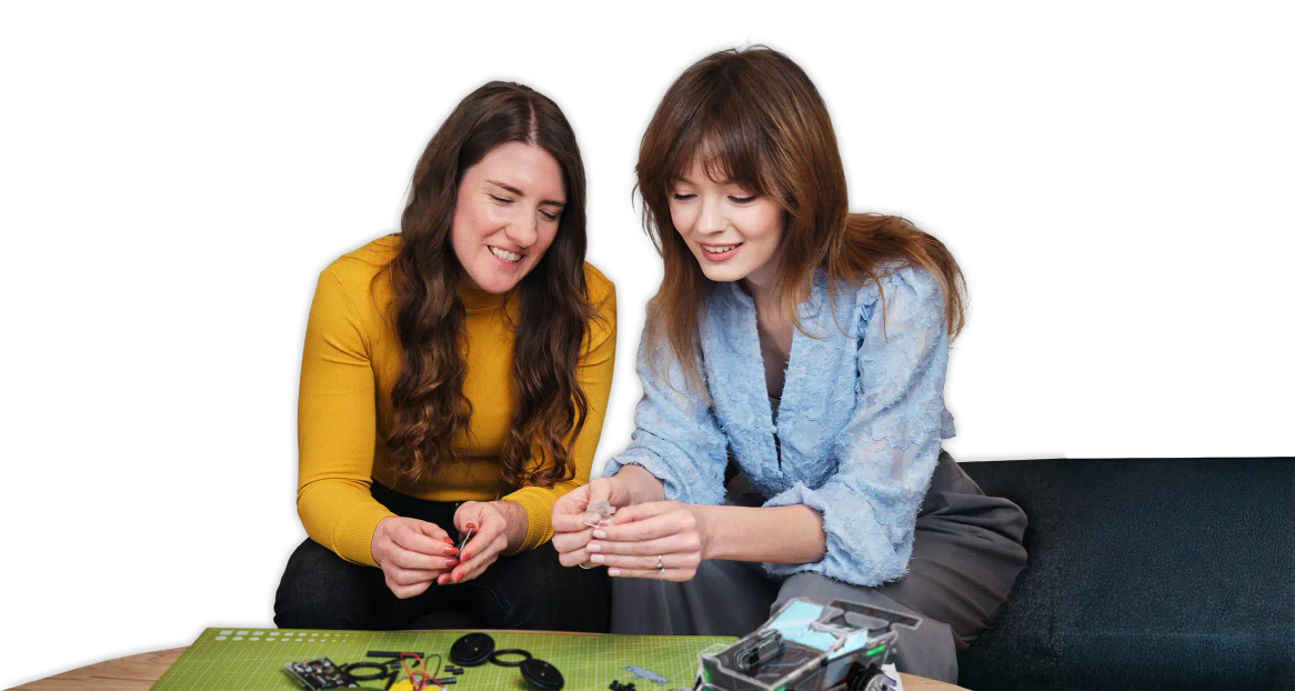 Two women assembling CircuitMess Sparkly