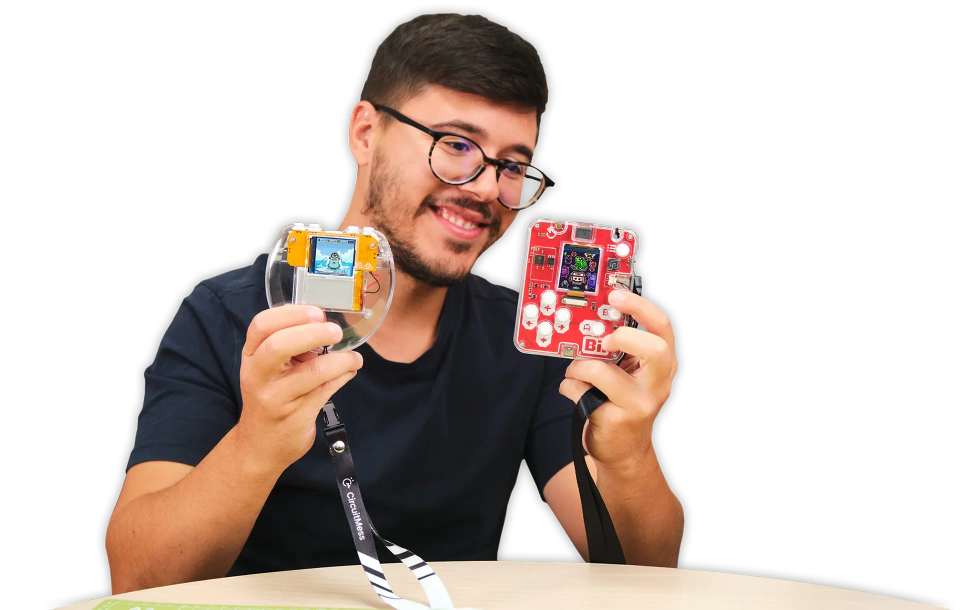 A man showing CircuitMess Codee 2.0 and Bit 2.0.
