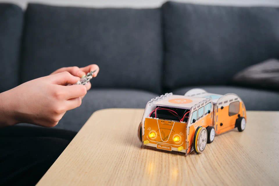 A person controlling CircuitMess Planck with a controller