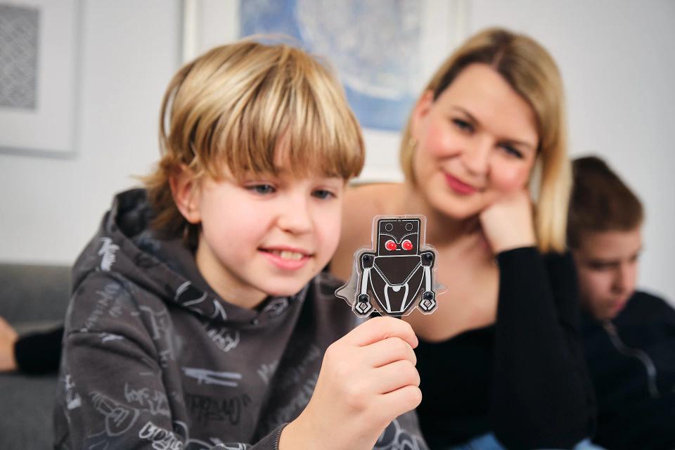 Mother and son playing with CircuitMess Resistron