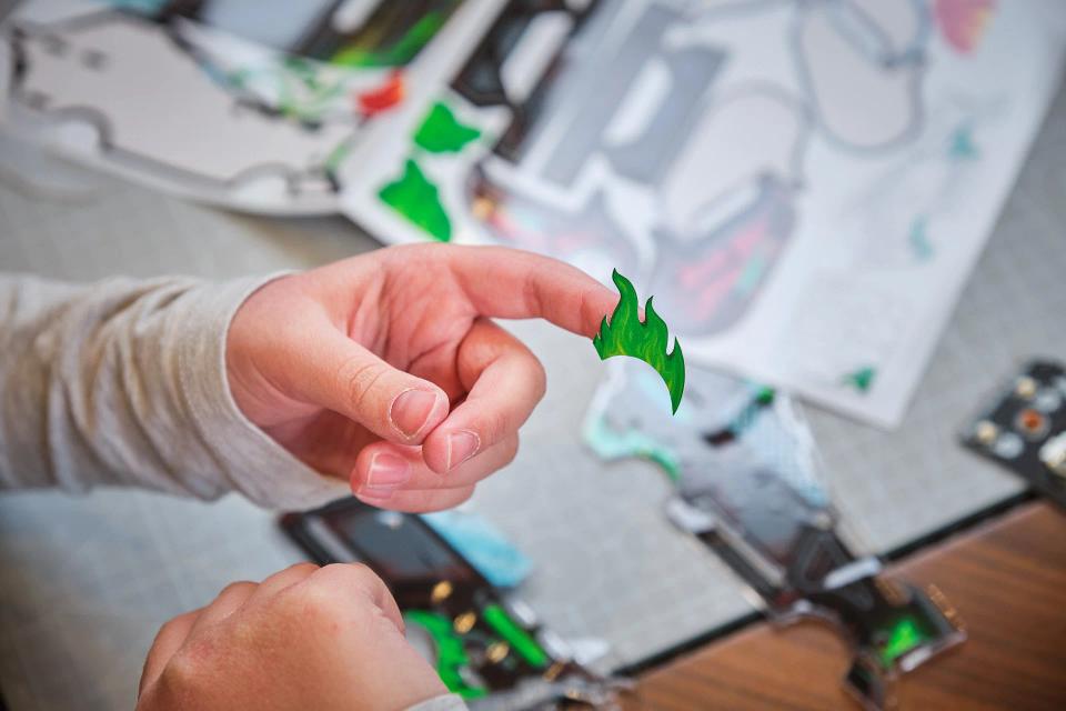 A person playing with CircuitMess Sparkly stickers
