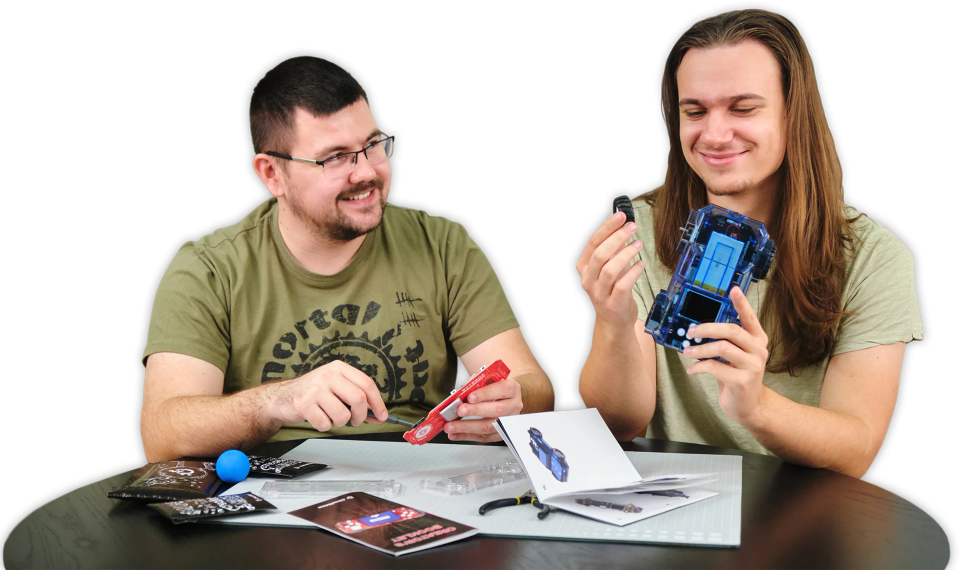 Two man assembling CircuitMess ByteBoi 2.0 and Wheelson 2.0.