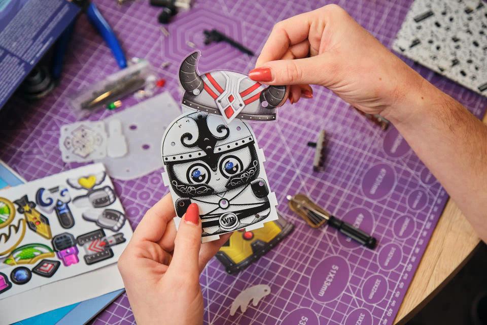 A person assembling CircuitMess Harald