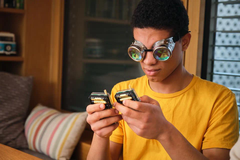 A man playing with CircuitMess Chatter