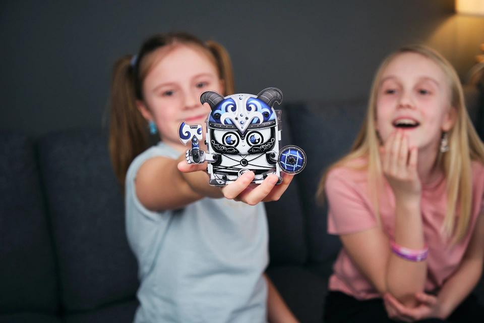 Two girls showcasing a built CircuitMess Harald