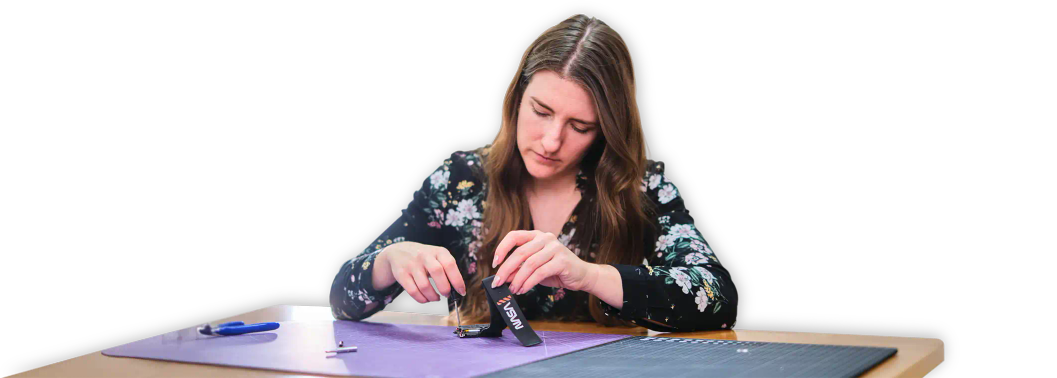 A woman assembling CircuitMess NASA Artemis Watch