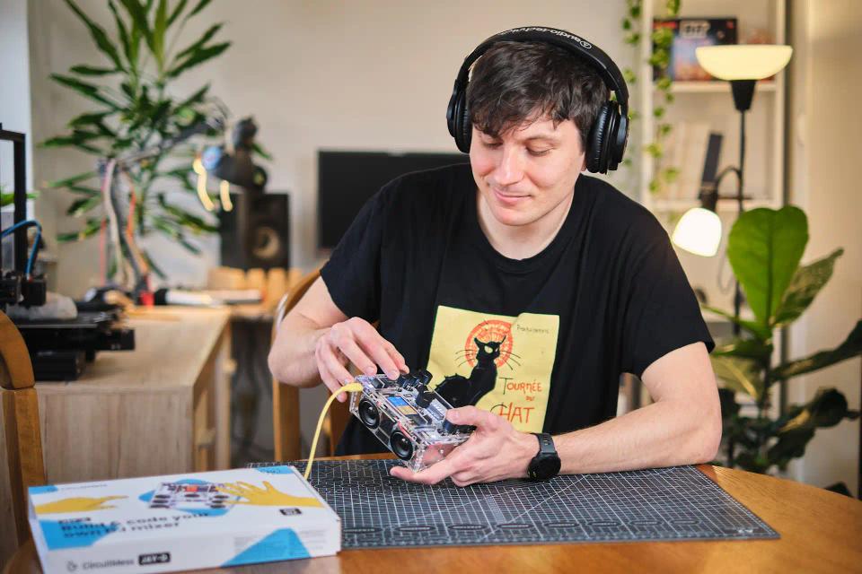 A man playing with CircuitMess Jay-D