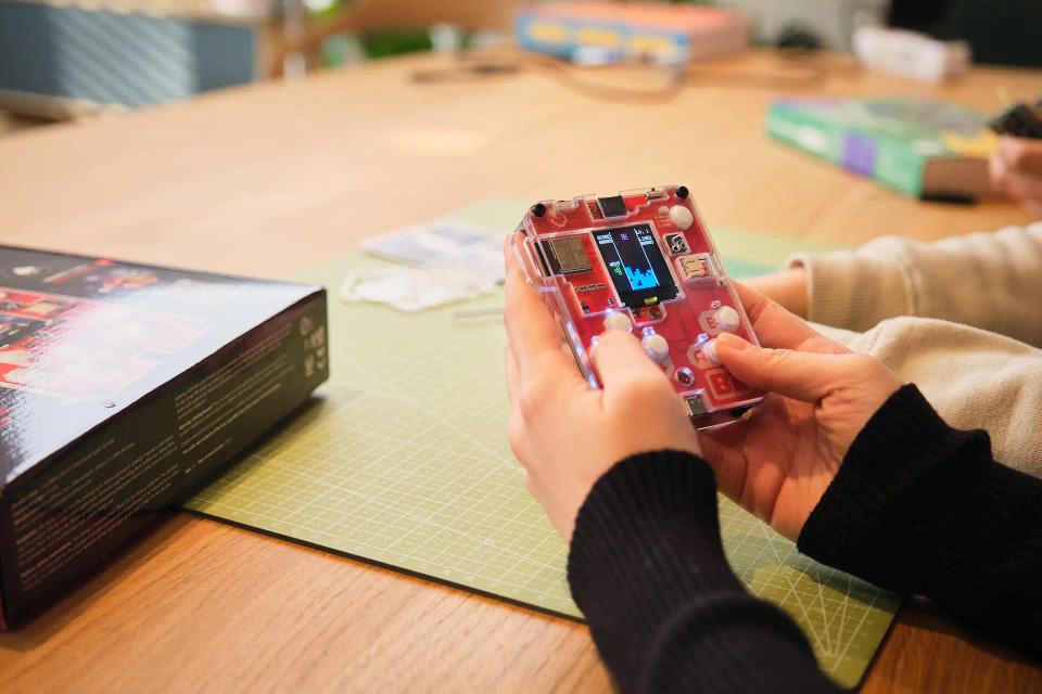 A person playing with CircuitMess Bit