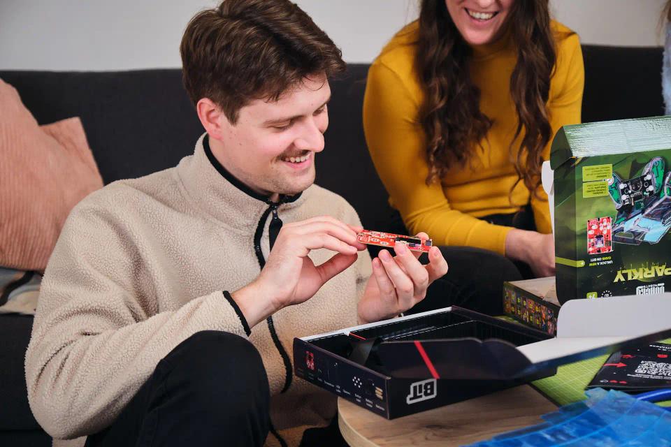 Two people playing with CircuitMess Bit