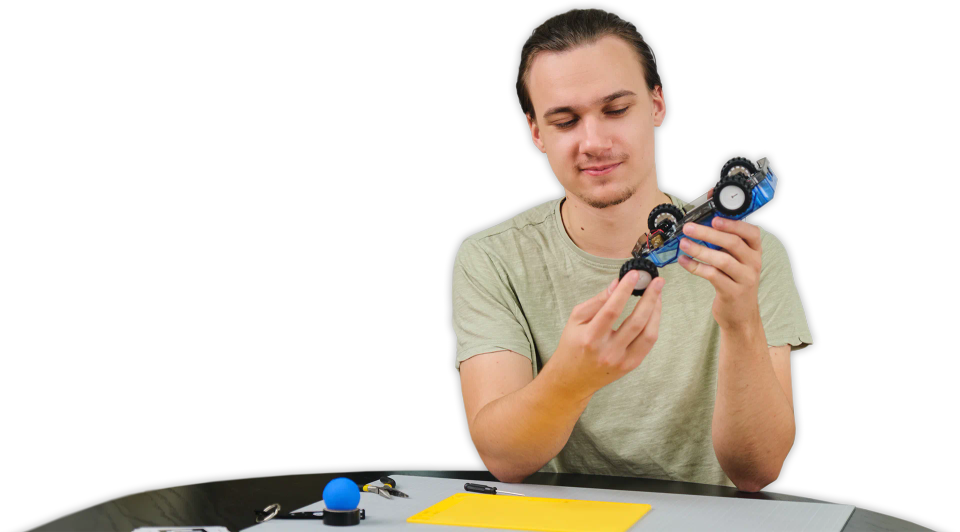 A man assembling CircuitMess Wheelson 2.0