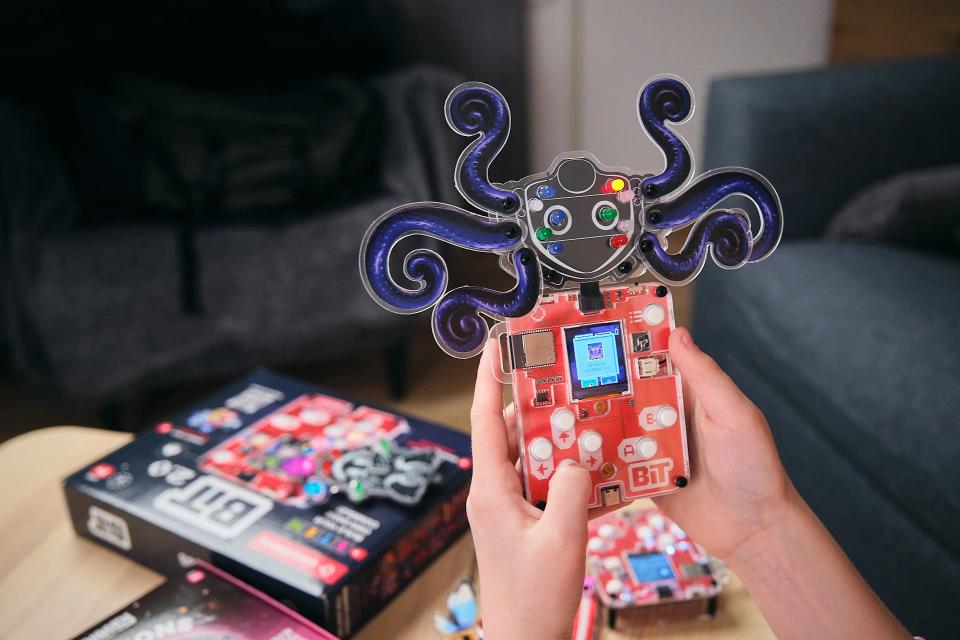 A person playing an additional CircuitMess Bit game unlocked by Artemis