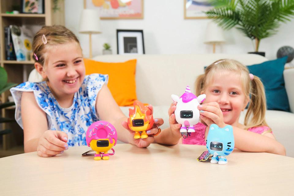 Two girls playing with CircuitMess Beep Boop Kirin, Miao Miao, Mochi and Tochi.