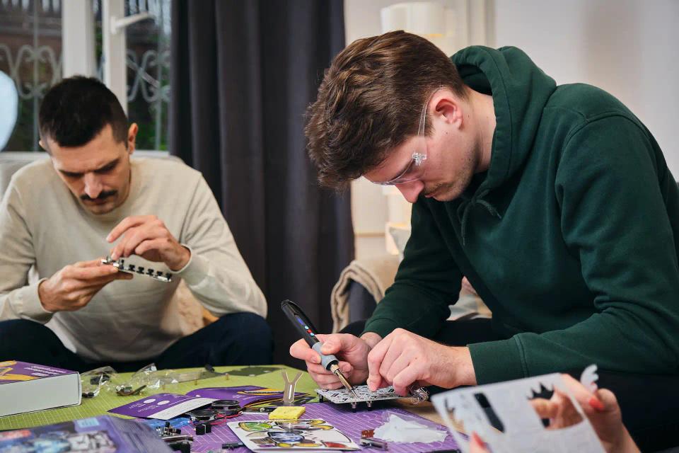 A group of people assembling CircuitMess products