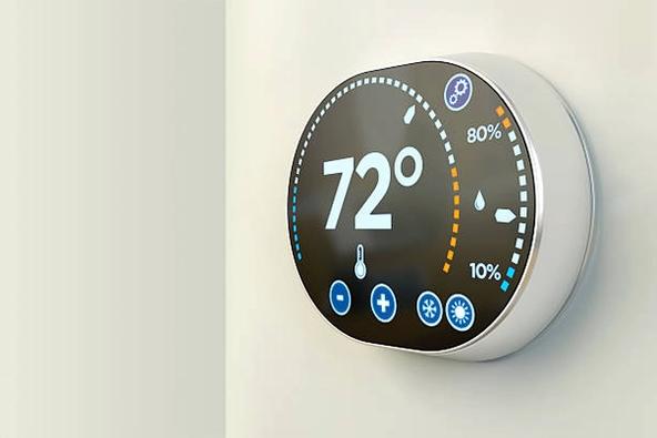 Smart thermostat on wall