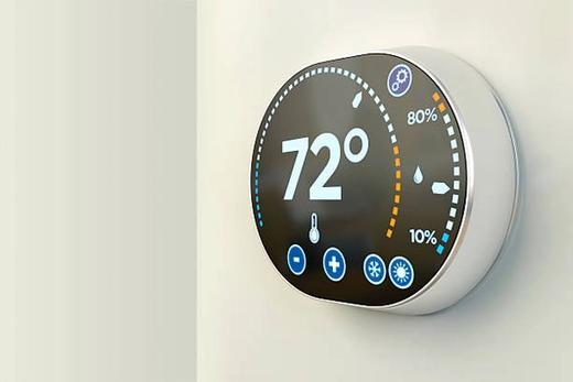 Smart thermostat on a wall