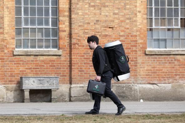 tester arriving on site with portable pulse equipment