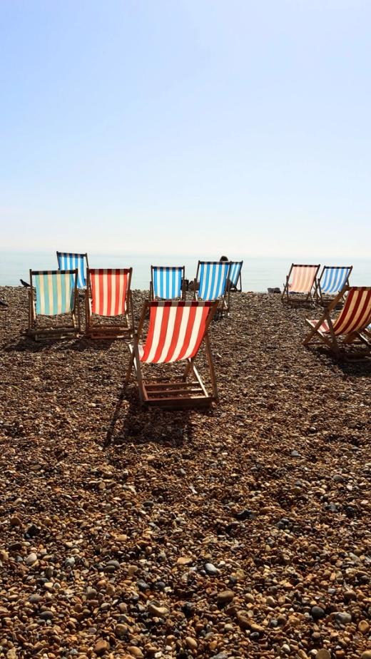 striped deckchairs on a british beach on a sunny day. the image accompanies a summer round up of all the events Build test Solutions attended in the Summer of 24