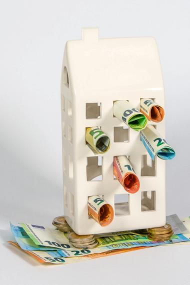 house with money plugging the gaps